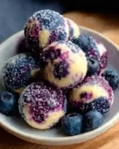 A delicious plate of Blueberry Cheesecake Protein Bites