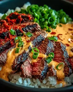 A delicious plate of Irresistibly Easy Korean BBQ Steak Rice Bowls with Spicy Cream Sauce