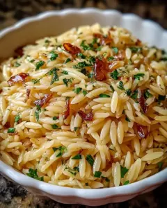A delicious plate of Orzo Rice Pilaf with Garlic and Herbs